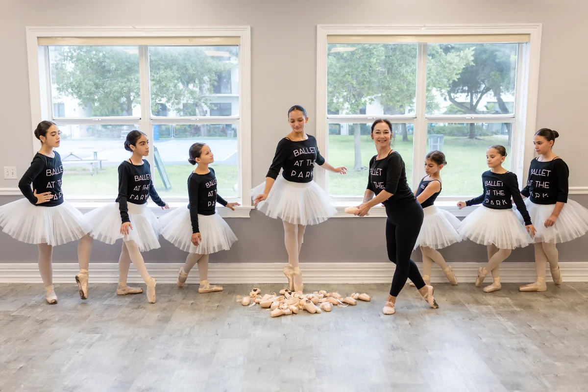 Ballet At The Park dancers at the barre with their teacher